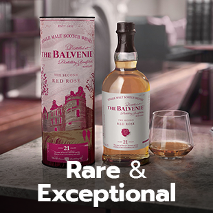Rare and exceptional. Bottle of The Balvenie with its packaging and a glass of whisky next to it.
