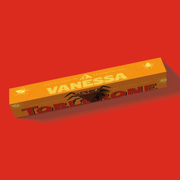 Personalised Toblerone Large 750g Bar in front of a red background