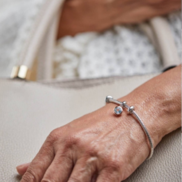 women wearing silver bracelet