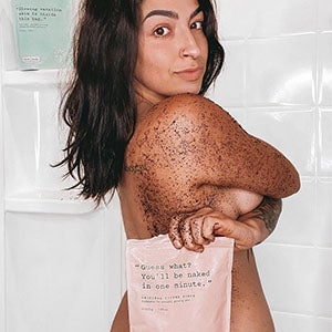 Woman using Original Coffee Scrub on back and arm. Shop All Products