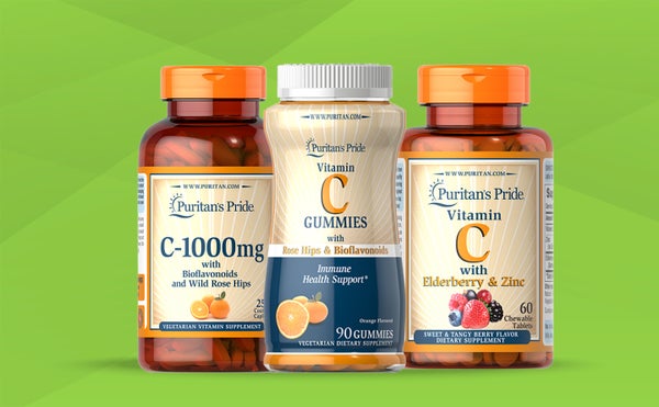 Three packs of different supplements - vitamin c with rose hips, Vitamin C gummies and vitamin c with zinc - standing on a green background.