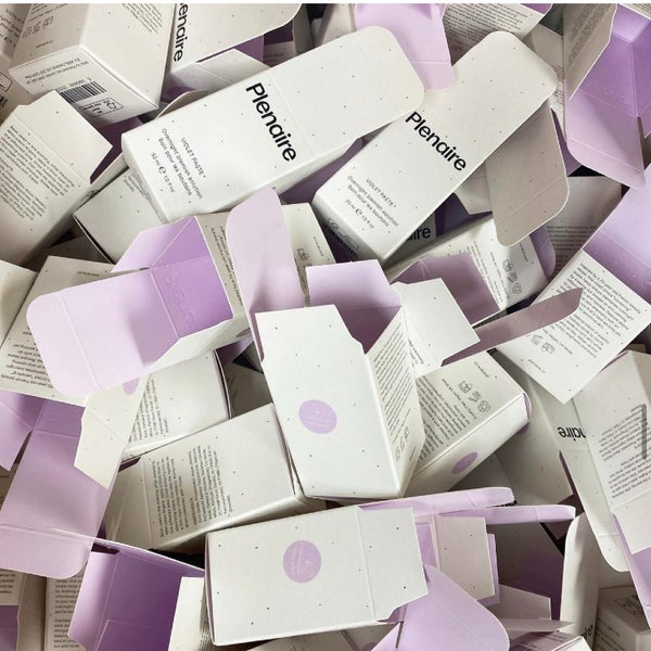 Full image of Plenaire Violet Paste blemish solution packaging open with violet inside of box visible. Visit our instagram