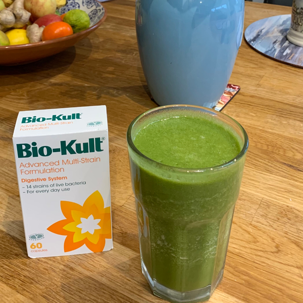 Spinach smoothie and Bio-kult capsules on a table  - Visit our instagram