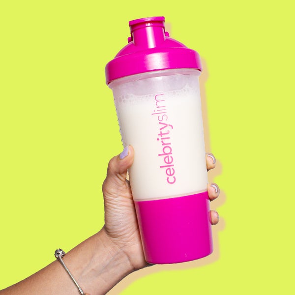 A Celebrity Slim Shaker being held on a yellow background