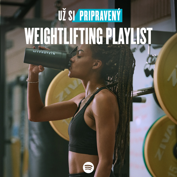 A woman wearing black workout clothes drinking from a black Myprotein shaker with the words 'You're Already Ready - Weightlifting Playlist' overlaying.