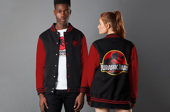 Two models wearing our new Jurassic Park Logo varsity jacket with red sleeves.