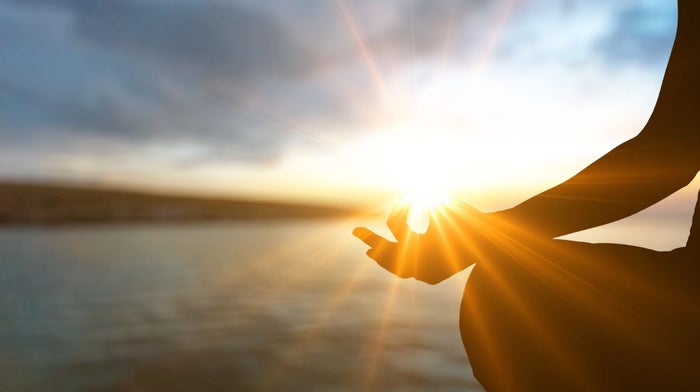 A man tries yoga, a gentle exercise that could support immunity.