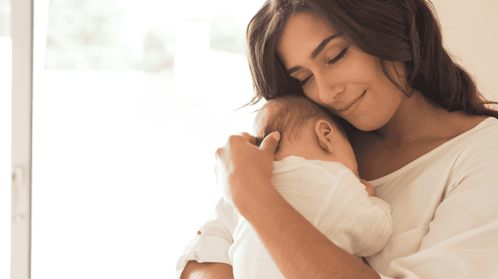 woman holding her baby