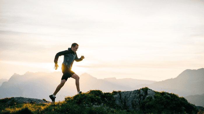 Men running on hill