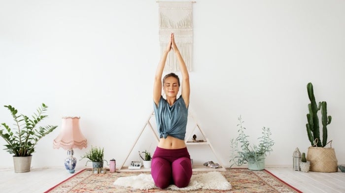 woman doing yoga at home