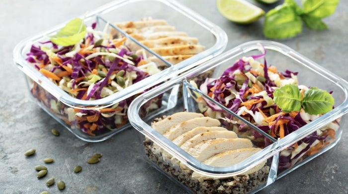 healthy food prep with chicken breast and salad