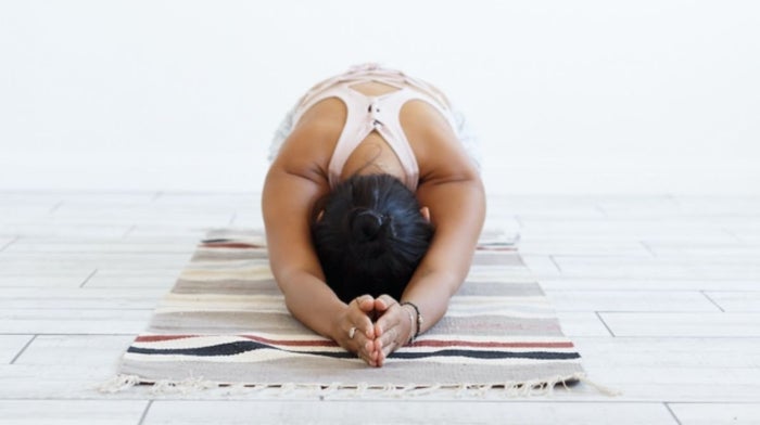 woman practising mindful yoga