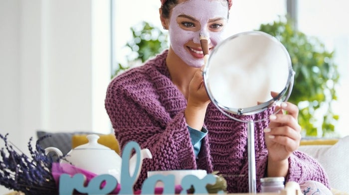 woman applying face mask