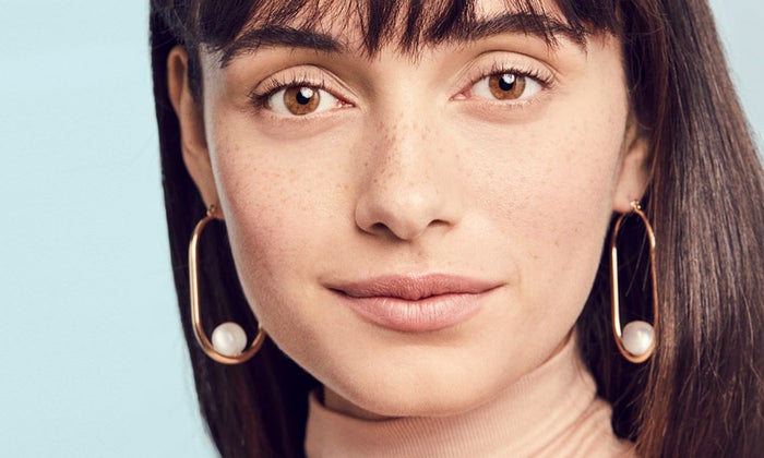 Girl With Freckles on Blue Background 2