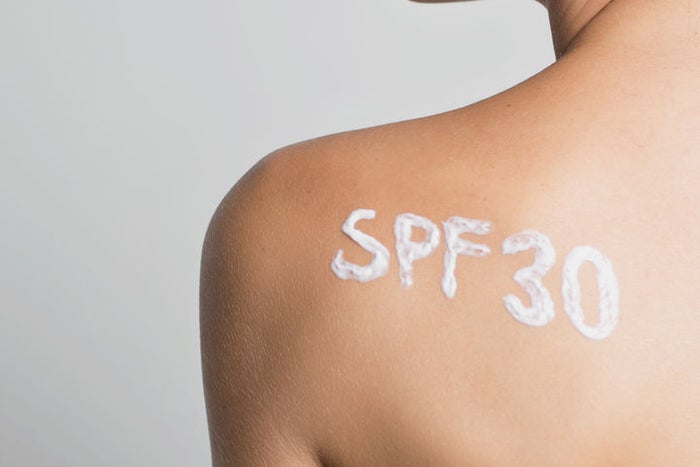 woman with spf 30 on her shoulder