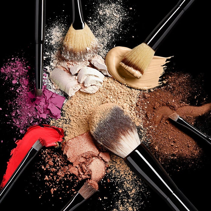 makeup brushes with coloured pigments and powders