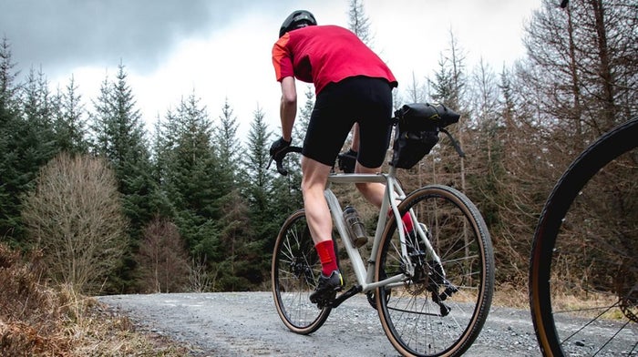 Cyclist travels along road