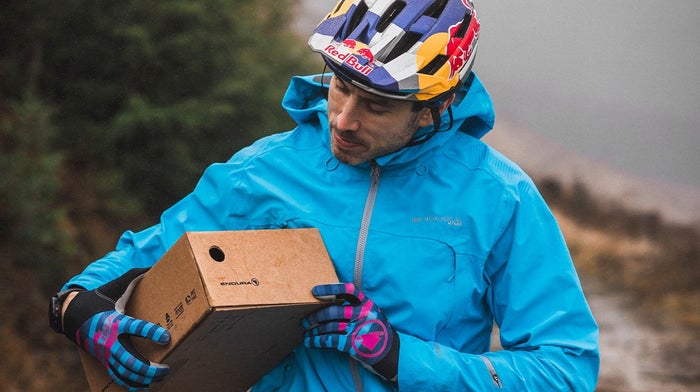 Man holds Endura shoe box