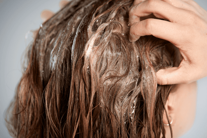 brown hair being washed