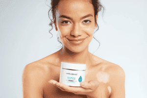 woman holding Ameliorate restorative facial mask