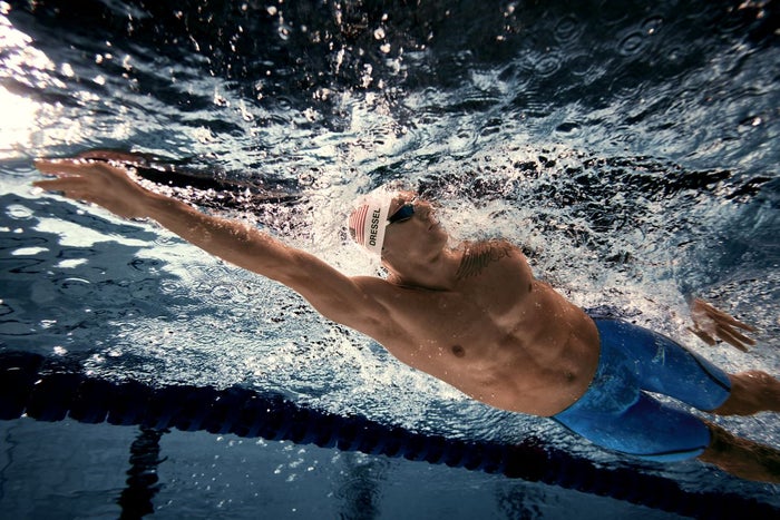 Caeleb Dressel swimming in a pool.