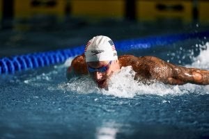 Caeleb Dressel swimming in a pool.