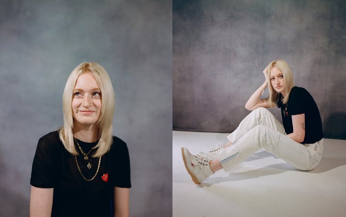 Rosie Matheson poses for photo sat on floor