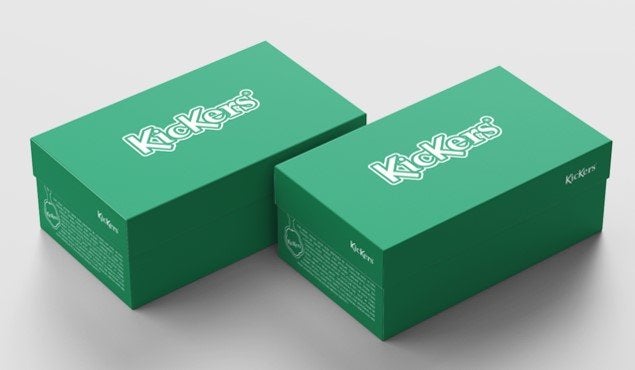 Two green Kickers Vegan shoe boxes.