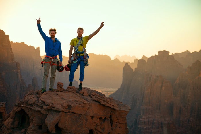 Duo celebrate atop cliff