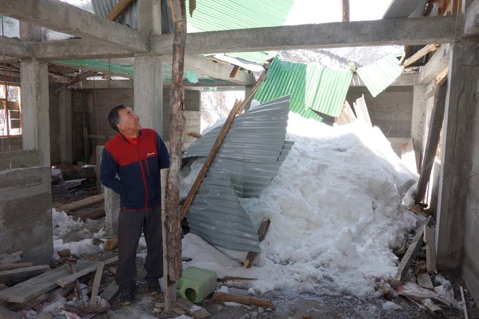Ice breaks roof of building
