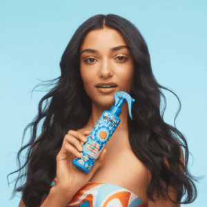 Woman holding leave-in conditioner