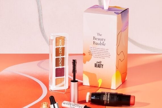 the cult beauty beauty bauble with the four products outside of it 