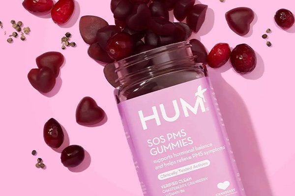 hum nutrition SOS pms gumies against a pink background