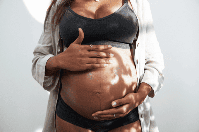pregnant woman holding bump