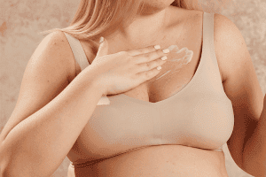 Model rubbing mama mio boob tube into her chest