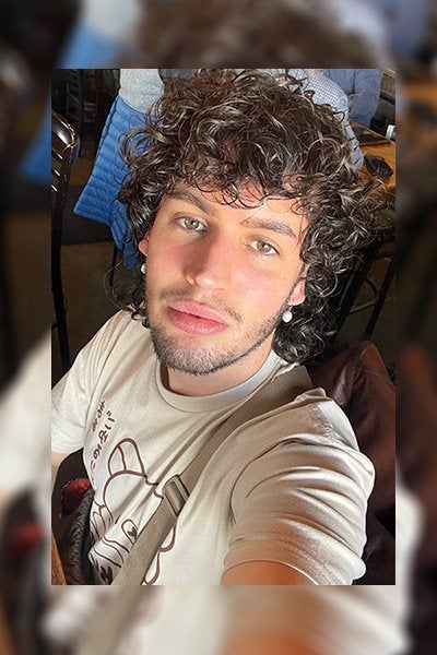a male model with curly hair