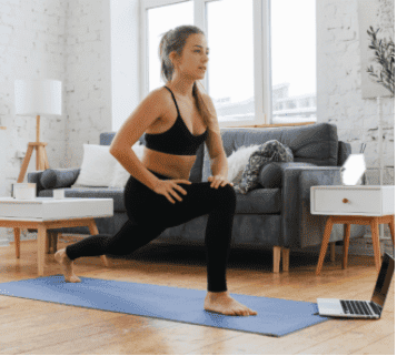 A woman doing yoga at home. 