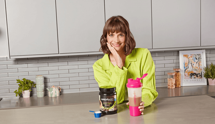 Woman holding a dairy free shake