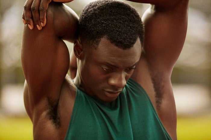 man stretching triceps