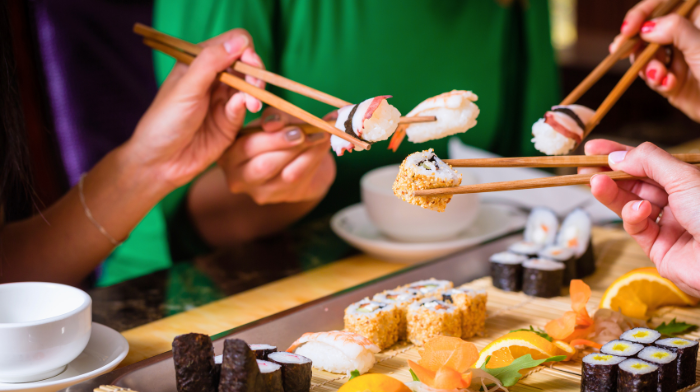 people eating sushi