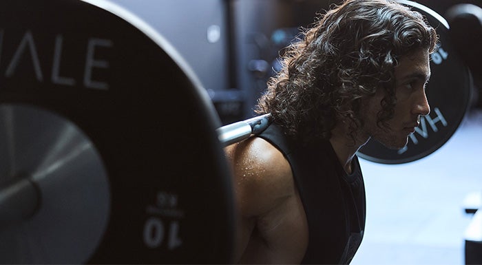 man lifting dumbbell