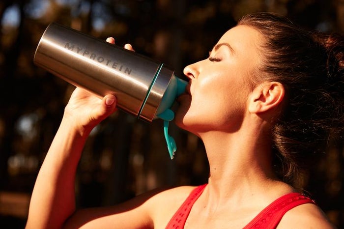 woman having post-workout drink