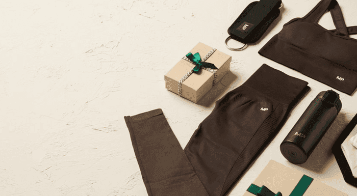 A black activewear set with Christmas gift boxes for activewear deals at Myprotein.