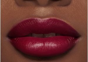 woman wearing dark berry lipstick