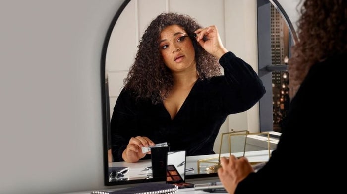 Woman applying Eyeko mascara