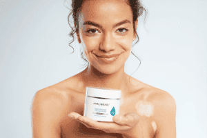 woman holding Restorative Facial Mask