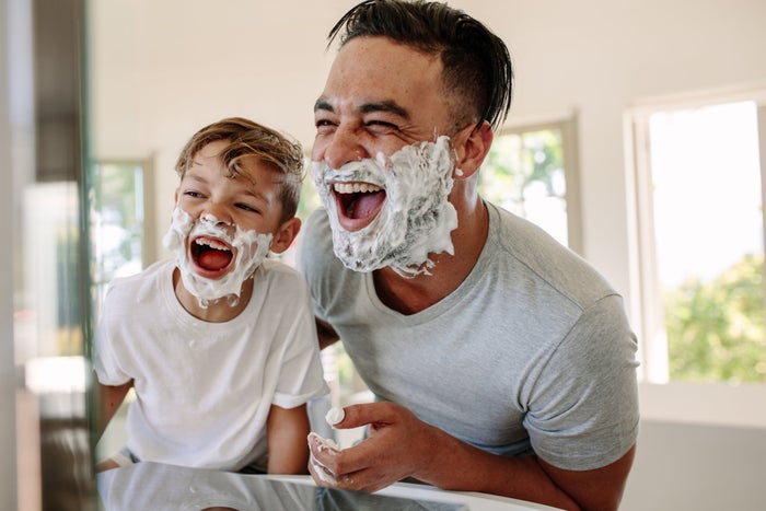 image of father and son with shaving gel applied