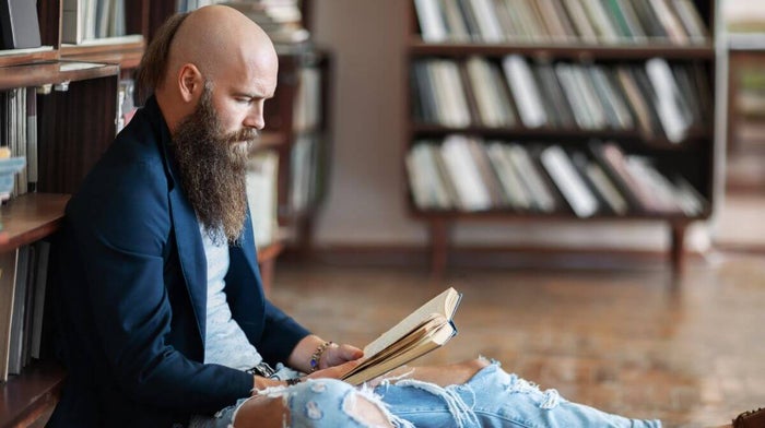 man with a full beard to hide a receding hairline