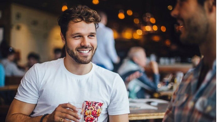 male friends chatting in a cafe