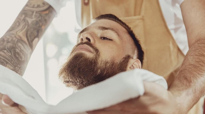 man having a hot towel shave